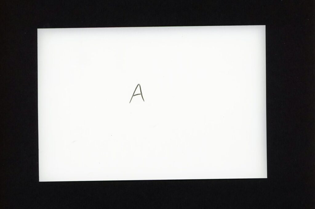 This shows a blank piece of photographic paper that has been developed without being exposed to white light. The edges are still fogged.