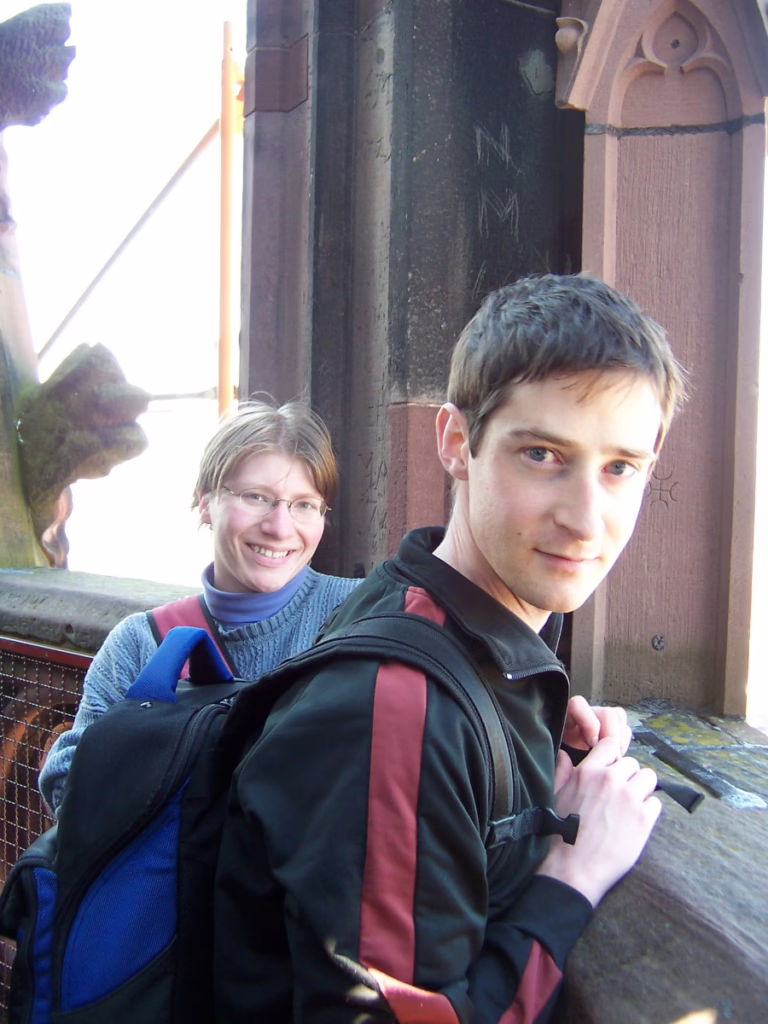 Two people stand inside of Freiburg Cathedral in 2006.