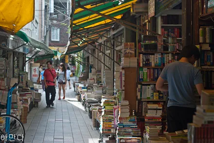 Book vendors line a narrow street in Busan, South Korea