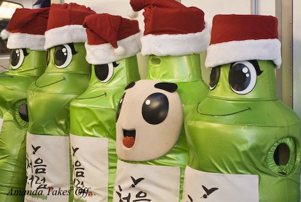 Large stuffed soju bottles wear santa hats in South Korea.